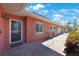 View of the home's front entrance, featuring a brick exterior and tiled walkway at 1694 Harbor W Cir, Largo, FL 33770