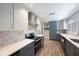 Modern kitchen featuring stainless steel appliances, stone backsplash, and stylish cabinetry at 1694 Harbor W Cir, Largo, FL 33770