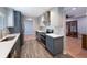 Updated kitchen with stainless appliances, white countertops, and gray cabinetry at 1694 Harbor W Cir, Largo, FL 33770