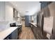 Gourmet kitchen featuring stainless steel appliances, and stylish backsplash at 1694 Harbor W Cir, Largo, FL 33770