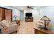 Open living room featuring neutral walls, terra cotta tile flooring, and natural lighting at 1694 Harbor W Cir, Largo, FL 33770
