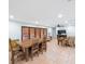 Open living room featuring neutral walls, terra cotta tile flooring, and natural lighting at 1694 Harbor W Cir, Largo, FL 33770