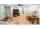 Open living room featuring neutral walls, terra cotta tile flooring, and natural lighting at 1694 Harbor W Cir, Largo, FL 33770