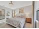 Well-lit bedroom with a large bed, nightstands, and an ensuite bathroom at 1824 Saddlewood Cir, Port Charlotte, FL 33953