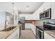 Kitchen showcasing granite countertops, stainless steel appliances and white cabinetry at 1824 Saddlewood Cir, Port Charlotte, FL 33953
