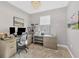 Functional home office featuring multiple monitors, desk space, and ample natural light at 1824 Saddlewood Cir, Port Charlotte, FL 33953