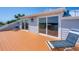 Exterior view of a private balcony with deck chairs and sliding glass doors overlooking the waterway at 19 Grouper Hole Dr, Boca Grande, FL 33921