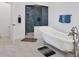 Luxurious bathroom with a freestanding tub and a glass-enclosed shower at 19 Grouper Hole Dr, Boca Grande, FL 33921