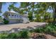 Charming home featuring a wrap-around porch, well-maintained landscaping, and a spacious driveway at 19 Grouper Hole Dr, Boca Grande, FL 33921