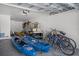 Spacious two-car garage with golf cart, kayaks, bicycles, and ample storage space at 19 Grouper Hole Dr, Boca Grande, FL 33921