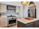 Close-up of kitchen featuring a stainless steel oven and modern appliances at 19 Grouper Hole Dr, Boca Grande, FL 33921