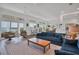 Spacious living room with floor-to-ceiling windows and comfortable seating at 19 Grouper Hole Dr, Boca Grande, FL 33921