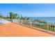 Rooftop deck with railing overlooking lush greenery and ocean at 19 Grouper Hole Dr, Boca Grande, FL 33921