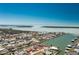 Waterfront home boasts beautiful views, private boat dock, and tropical landscaping in a canal community at 1957 Arkansas Ave, Englewood, FL 34224