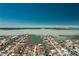Waterfront home boasts beautiful views, private boat dock, and tropical landscaping in a canal community at 1957 Arkansas Ave, Englewood, FL 34224