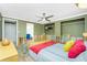 Spacious bedroom featuring ceiling fan and an area for closets at 1957 Arkansas Ave, Englewood, FL 34224