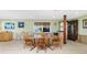 Dining room with tile floors and natural light at 1957 Arkansas Ave, Englewood, FL 34224