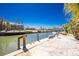 Waterfront property featuring a boat dock, boat lift, and a scenic view of the canal at 1957 Arkansas Ave, Englewood, FL 34224