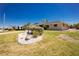 Well-maintained home with a beautifully landscaped front yard featuring a rock garden and lush lawn at 1957 Arkansas Ave, Englewood, FL 34224