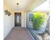 Welcoming front entrance with tiled porch and decorative details at 1957 Arkansas Ave, Englewood, FL 34224