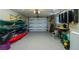 Spacious garage offering ample storage with kayaks, bikes, and workbench at 1957 Arkansas Ave, Englewood, FL 34224