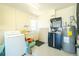 Functional garage area with laundry facilities, storage, and utility sink at 1957 Arkansas Ave, Englewood, FL 34224