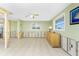 Bright living room features tile floor, natural light and ceiling fan at 1957 Arkansas Ave, Englewood, FL 34224