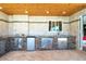 Stone outdoor kitchen with stainless steel appliances, sink, and storage, perfect for entertaining on the patio at 1957 Arkansas Ave, Englewood, FL 34224