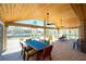 Spacious patio features canal views, a dining set, and an outdoor kitchen perfect for waterfront entertaining at 1957 Arkansas Ave, Englewood, FL 34224