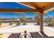 Inviting screened patio boasting canal views, complemented by lounge chairs and bright natural light at 1957 Arkansas Ave, Englewood, FL 34224