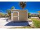 Durable shed with white trim and landscaping, providing secure storage and a neat aesthetic at 1957 Arkansas Ave, Englewood, FL 34224