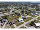 Expansive aerial view showcases the property with a private pool in a serene neighborhood at 2105 Arkansas Ave, Englewood, FL 34224