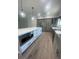 Bright kitchen features a large island with built-in microwave and stainless appliances at 220 Jennifer Dr, Rotonda West, FL 33947