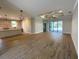 Open-concept living space with stylish wood floors and access to the pool at 220 Jennifer Dr, Rotonda West, FL 33947