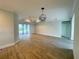 Spacious living room with decorative ceiling and large windows to the outdoor pool area at 220 Jennifer Dr, Rotonda West, FL 33947