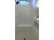 Tiled shower with a built-in bench and niche for toiletries at 220 Jennifer Dr, Rotonda West, FL 33947
