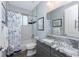 Stylish bathroom featuring gray vanity, a shower/tub combo, and modern fixtures at 228 White Marsh Ln, Rotonda West, FL 33947