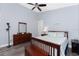 Bright bedroom showcasing a bed, dresser, and modern lighting with wood-look vinyl flooring at 228 White Marsh Ln, Rotonda West, FL 33947