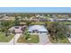 Beautiful single-story home with a well-manicured lawn and brick-paved driveway at 228 White Marsh Ln, Rotonda West, FL 33947