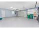 Spacious two-car garage featuring a clean epoxy floor and ample storage space at 228 White Marsh Ln, Rotonda West, FL 33947