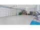 Spacious three car garage features epoxy flooring and ample storage space for tools and recreation equipment at 228 White Marsh Ln, Rotonda West, FL 33947
