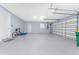Oversized three car garage with epoxy flooring and ample storage space at 228 White Marsh Ln, Rotonda West, FL 33947