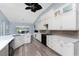 Bright kitchen with white cabinets, a vaulted ceiling, and modern appliances at 228 White Marsh Ln, Rotonda West, FL 33947