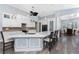 Modern kitchen featuring white cabinetry, granite countertops, pendant lighting, and stainless steel appliances at 228 White Marsh Ln, Rotonda West, FL 33947