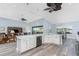 Bright, open kitchen features a large island with white cabinets and gray marble countertop at 228 White Marsh Ln, Rotonda West, FL 33947