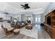 Spacious living room featuring wood floors, bright lighting, and open layout at 228 White Marsh Ln, Rotonda West, FL 33947