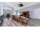Cozy living room showcasing wood floors, neutral paint, and comfortable seating at 228 White Marsh Ln, Rotonda West, FL 33947