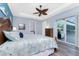 Main bedroom showcasing a ceiling fan and access to the outdoor patio at 228 White Marsh Ln, Rotonda West, FL 33947