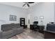 Large office space featuring a ceiling fan, desk, and comfortable seating area at 228 White Marsh Ln, Rotonda West, FL 33947