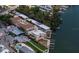 Stunning aerial view of waterfront property with docks, lush greenery, and community amenities at 2405 N Beach Rd # 10, Englewood, FL 34223